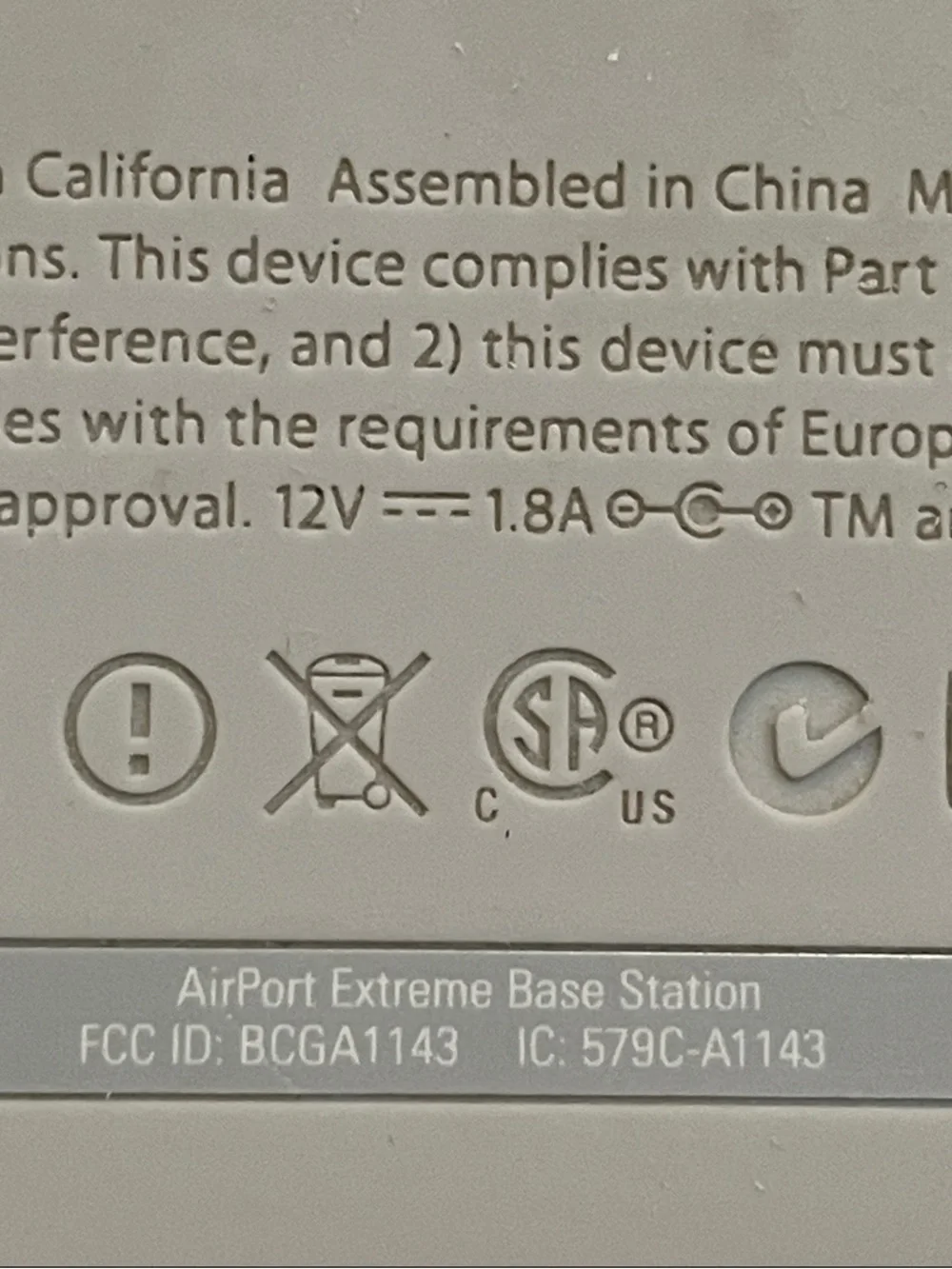 Apple AirPort Extreme base station with power supply.